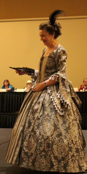 Lucinda Morris, the designer and creator of most of the costumes, in a baroque dress