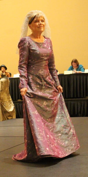 Owlyn Coughlin wearing a medieval royal gown